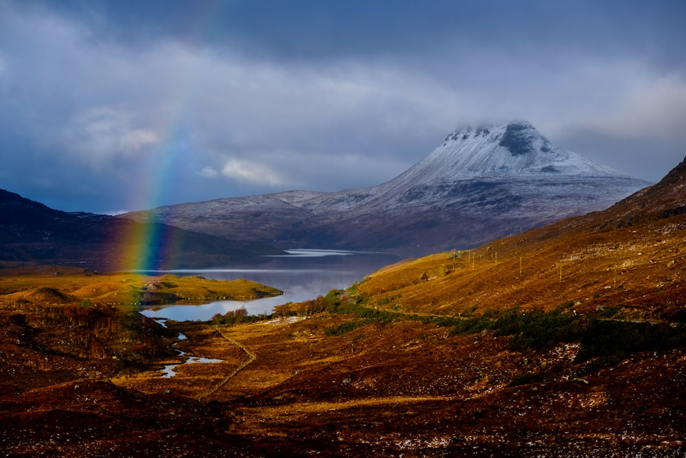 rainbow above brown field