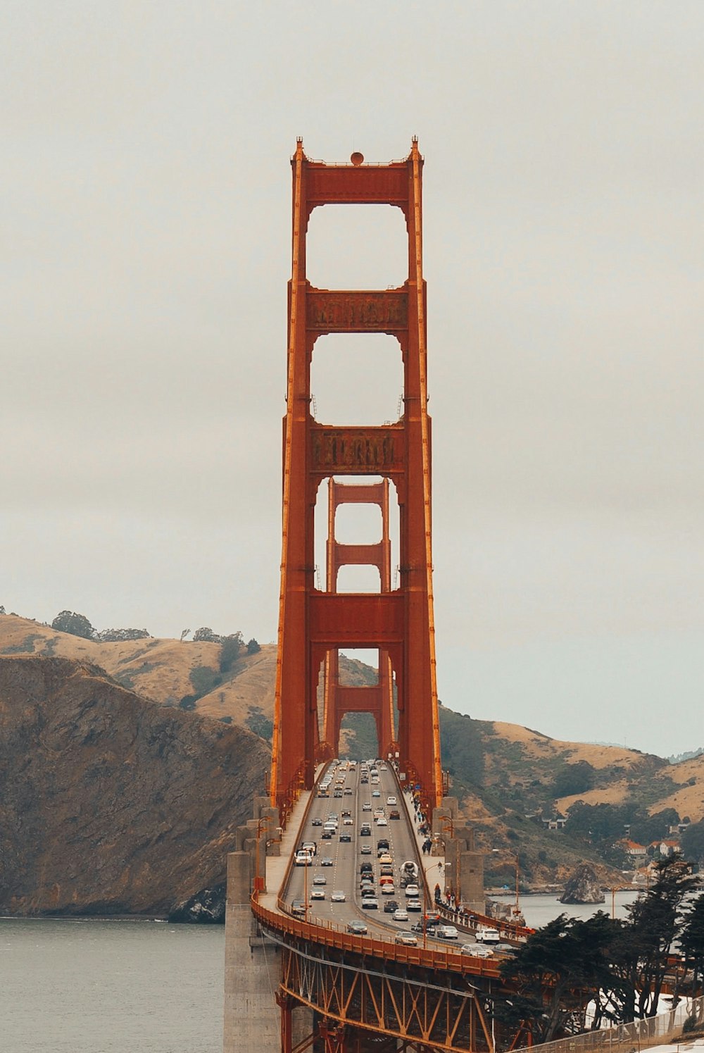 orange bridge near mountain range