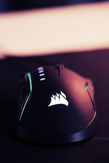 A stylish gaming mouse with customizable buttons and neon lighting