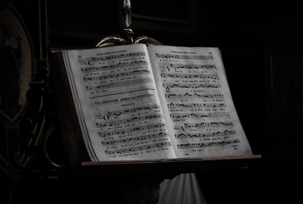 music notes on brown wooden easel