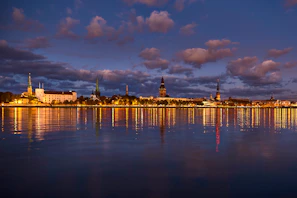 Evening cityscape of Florianópolis with illuminated buildings and calm waters