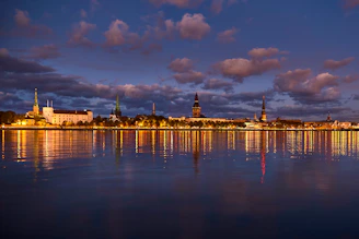 Evening cityscape of Florianópolis with illuminated buildings and calm waters
