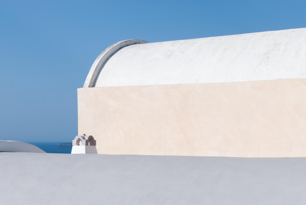 a white building with a blue sky in the background