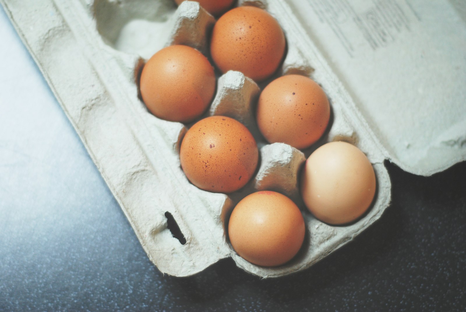 Nikon D3000 + Nikon AF Nikkor 50mm F1.8D sample photo. Seven brown eggs on photography