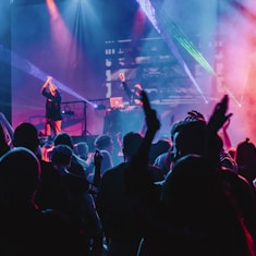 woman singing on stage