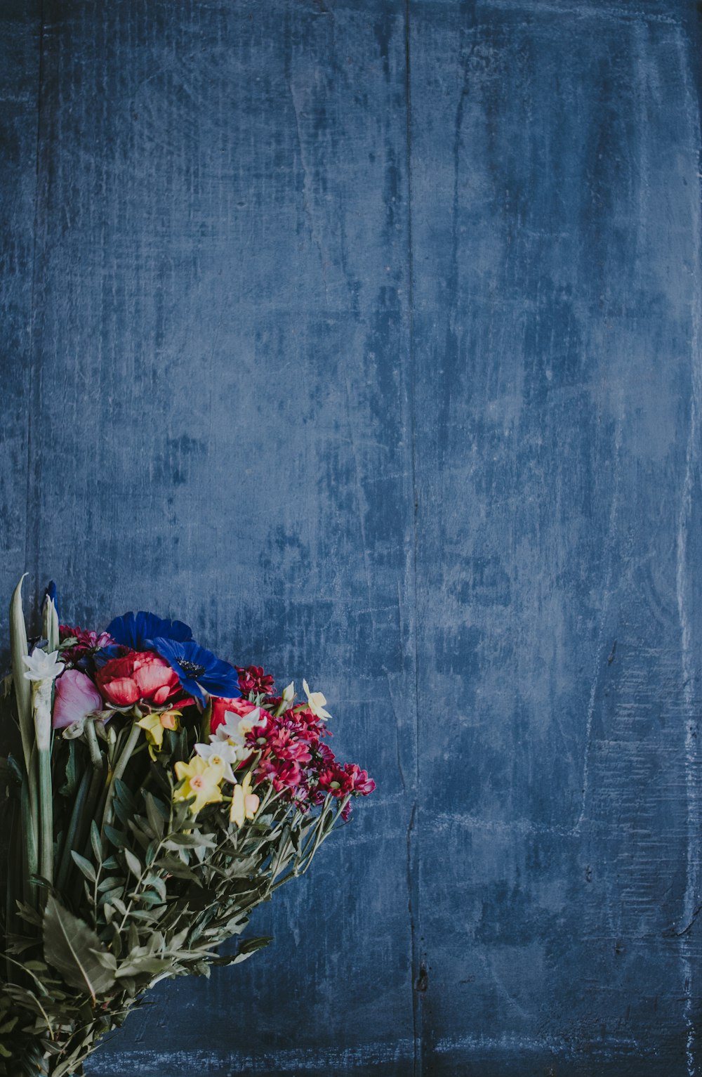 gray and red flower bouquet