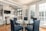 round clear glass-top table and five gray chairs dining se