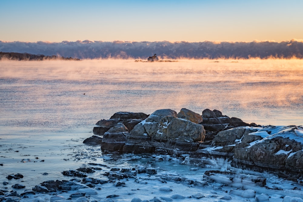 rocks on snow covered mountain