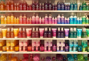 A colorful, well-organized retail shelf displaying various product assortments.