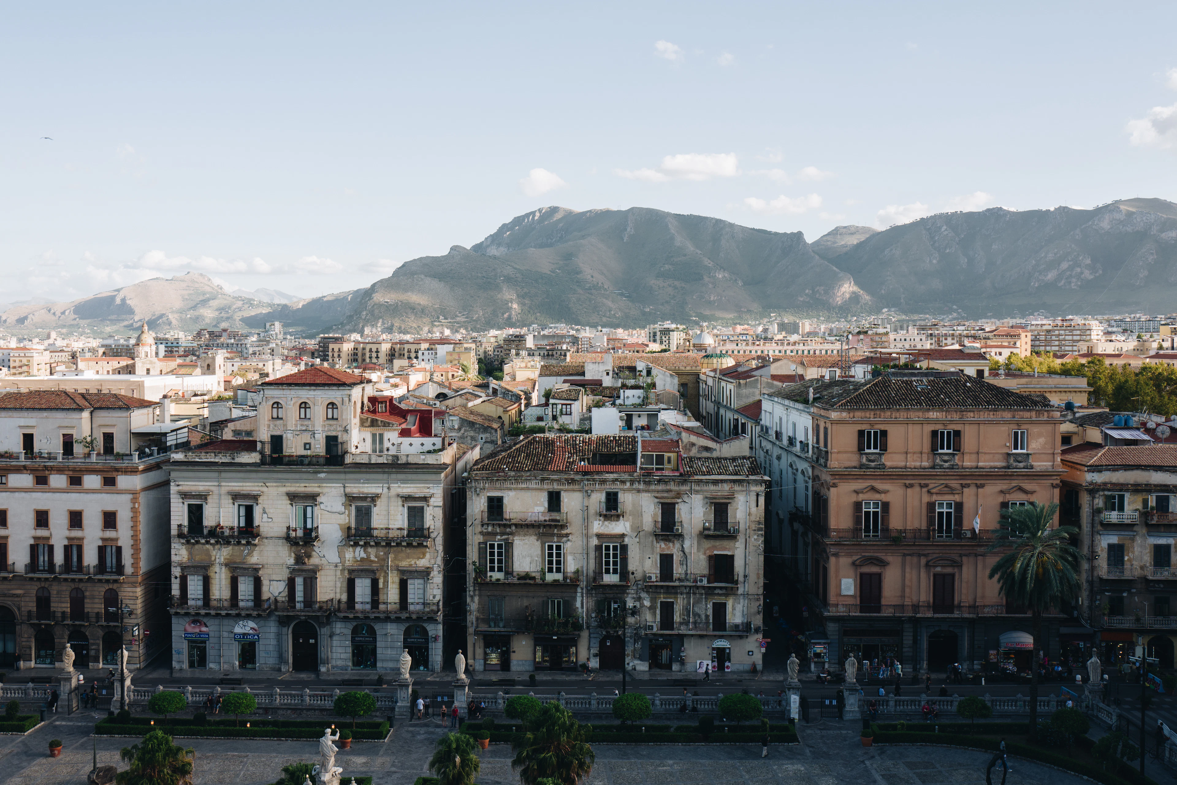 Palermo's rooftops with the mountains standing behind the city