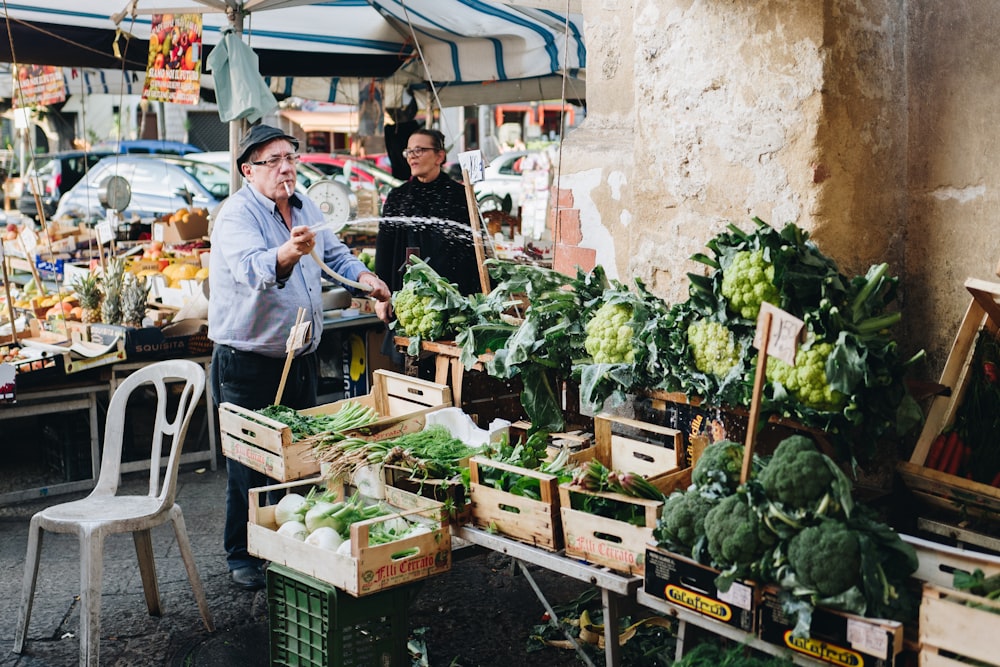 man watering vegetables