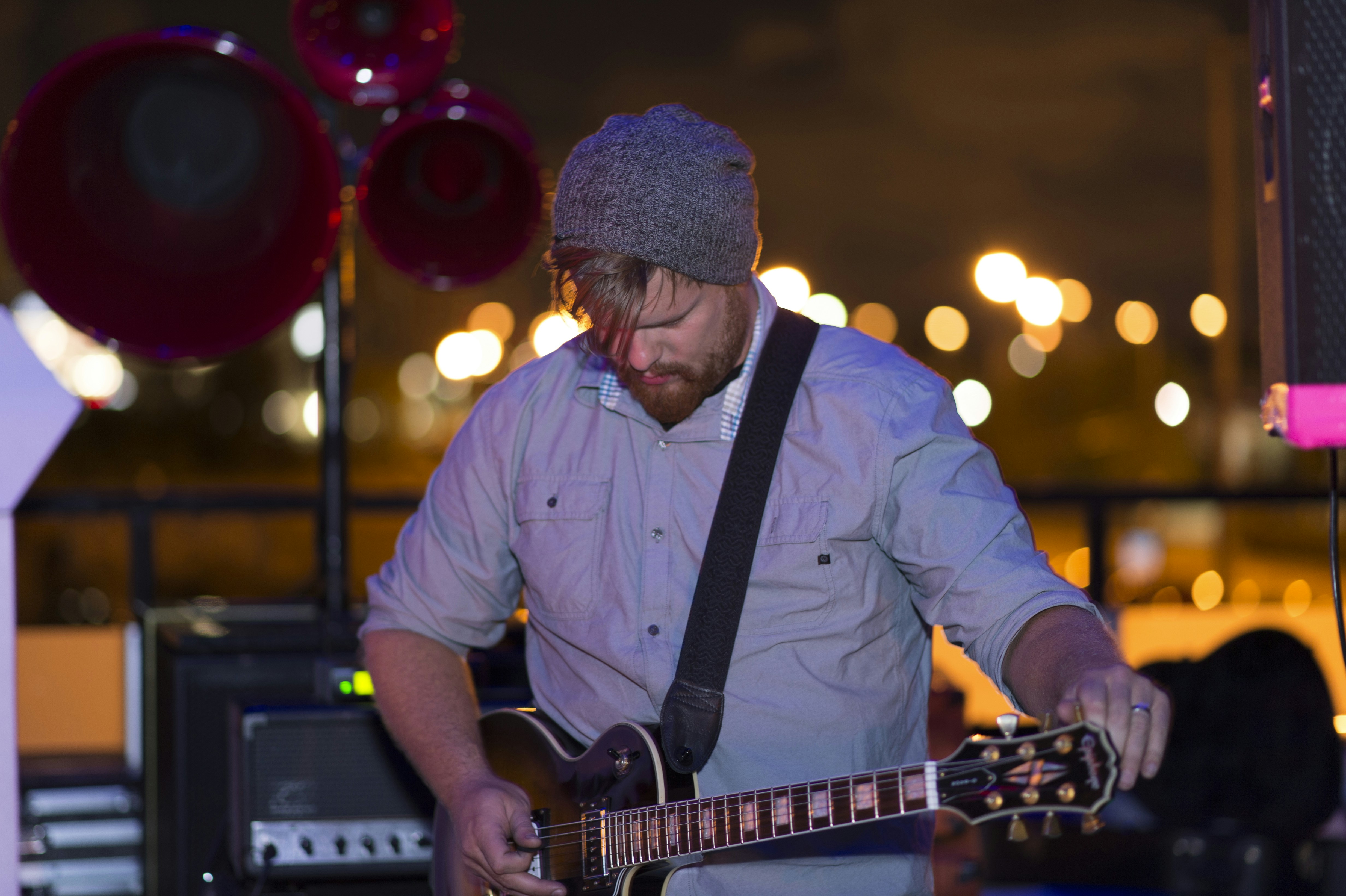 man playing acoustic guitar