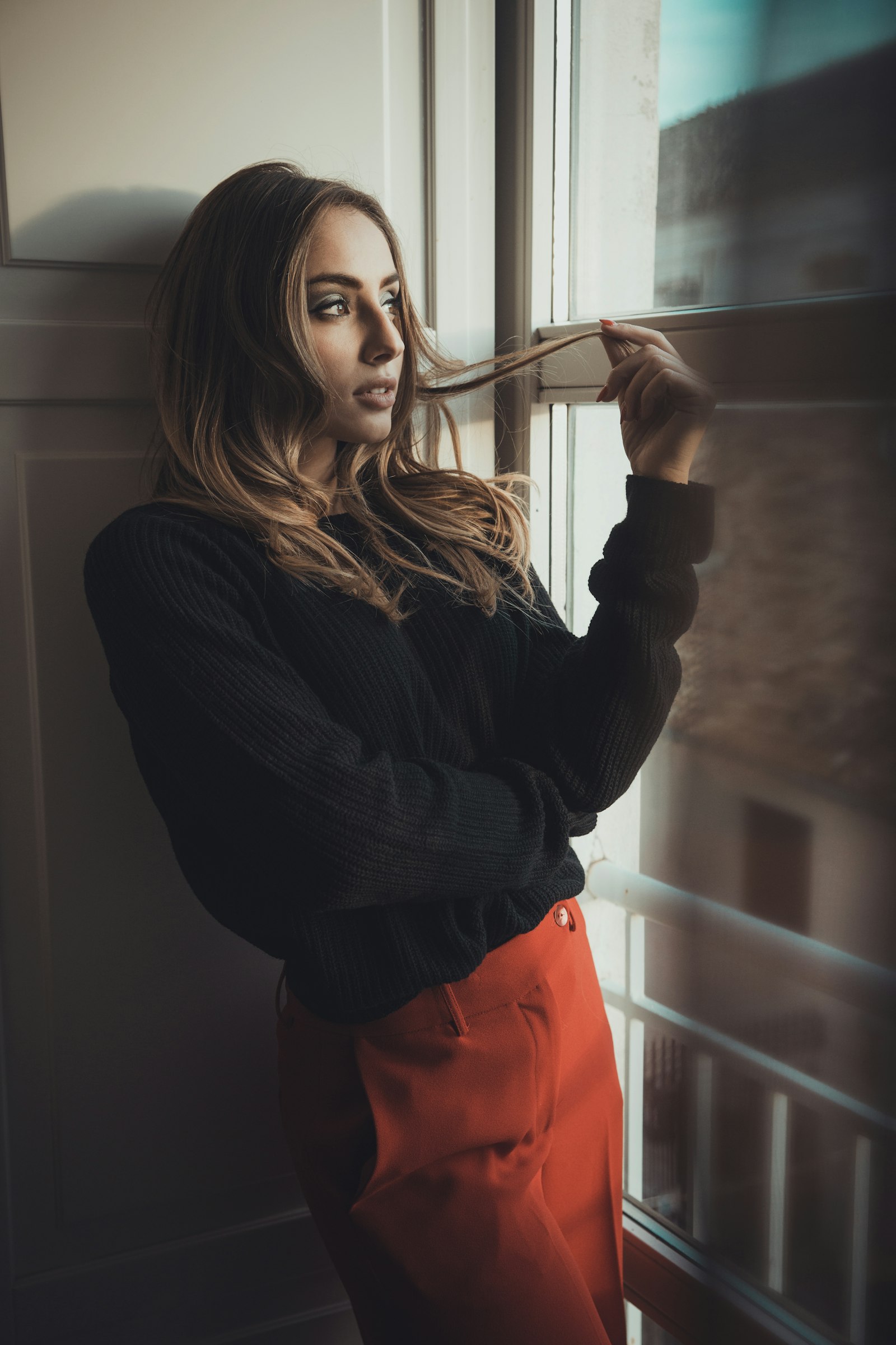 Sony a99 II sample photo. Woman standing beside mirror photography