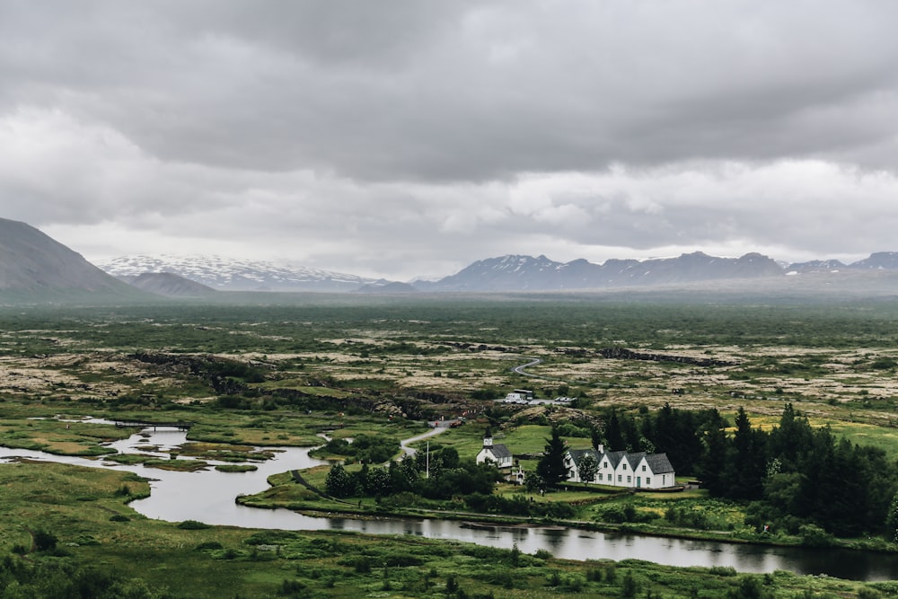 aerial photography of landscape farm under nimbus clouds