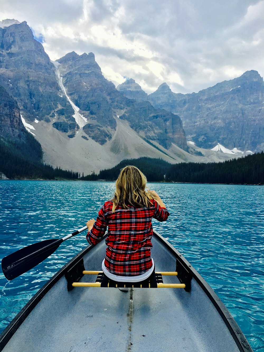 brown haired woman riding boat during day time