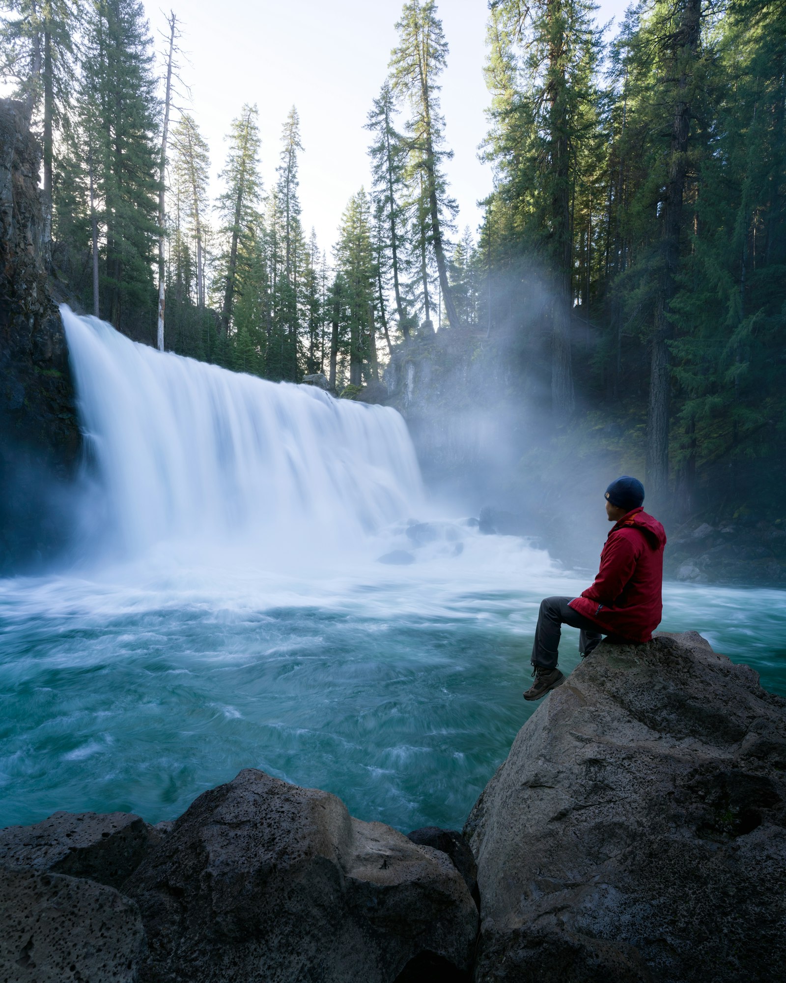 ZEISS Batis 18mm F2.8 sample photo. Man sitting near waterfalls photography