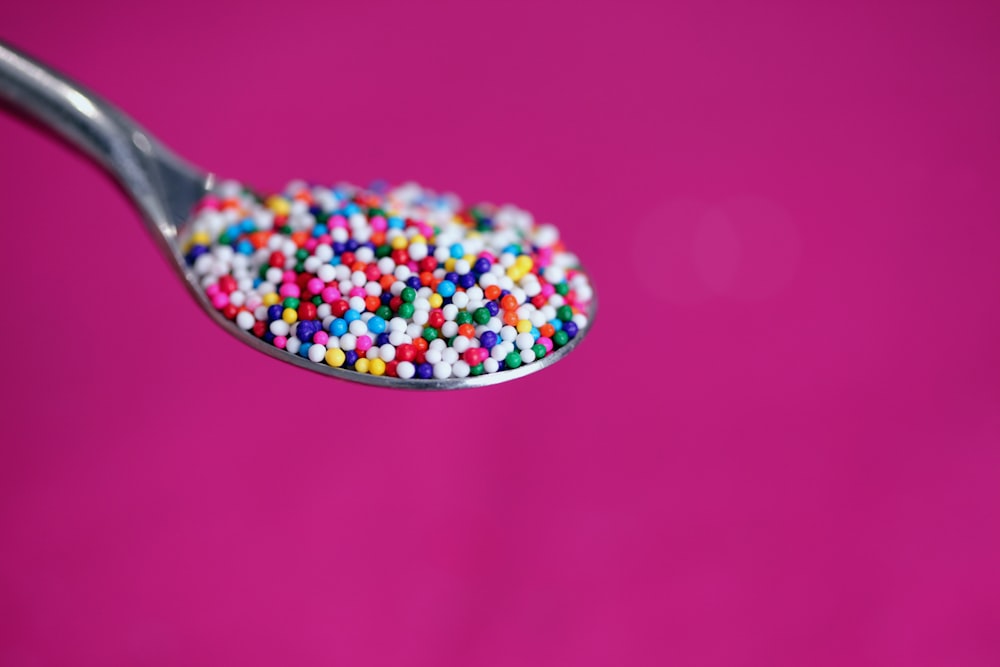 multicolored icing on stainless steel spoon