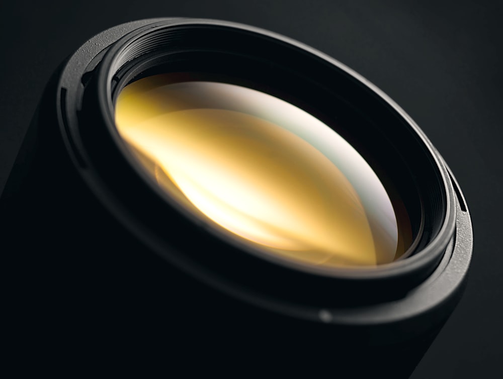 a close up of a camera lens on a black background