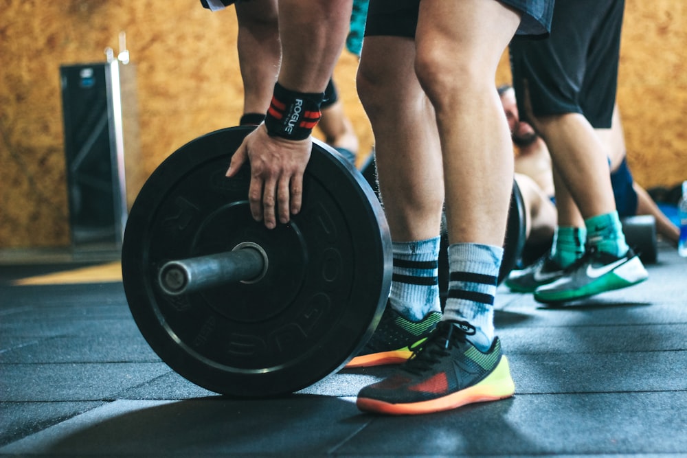 person about to lift the weight plate