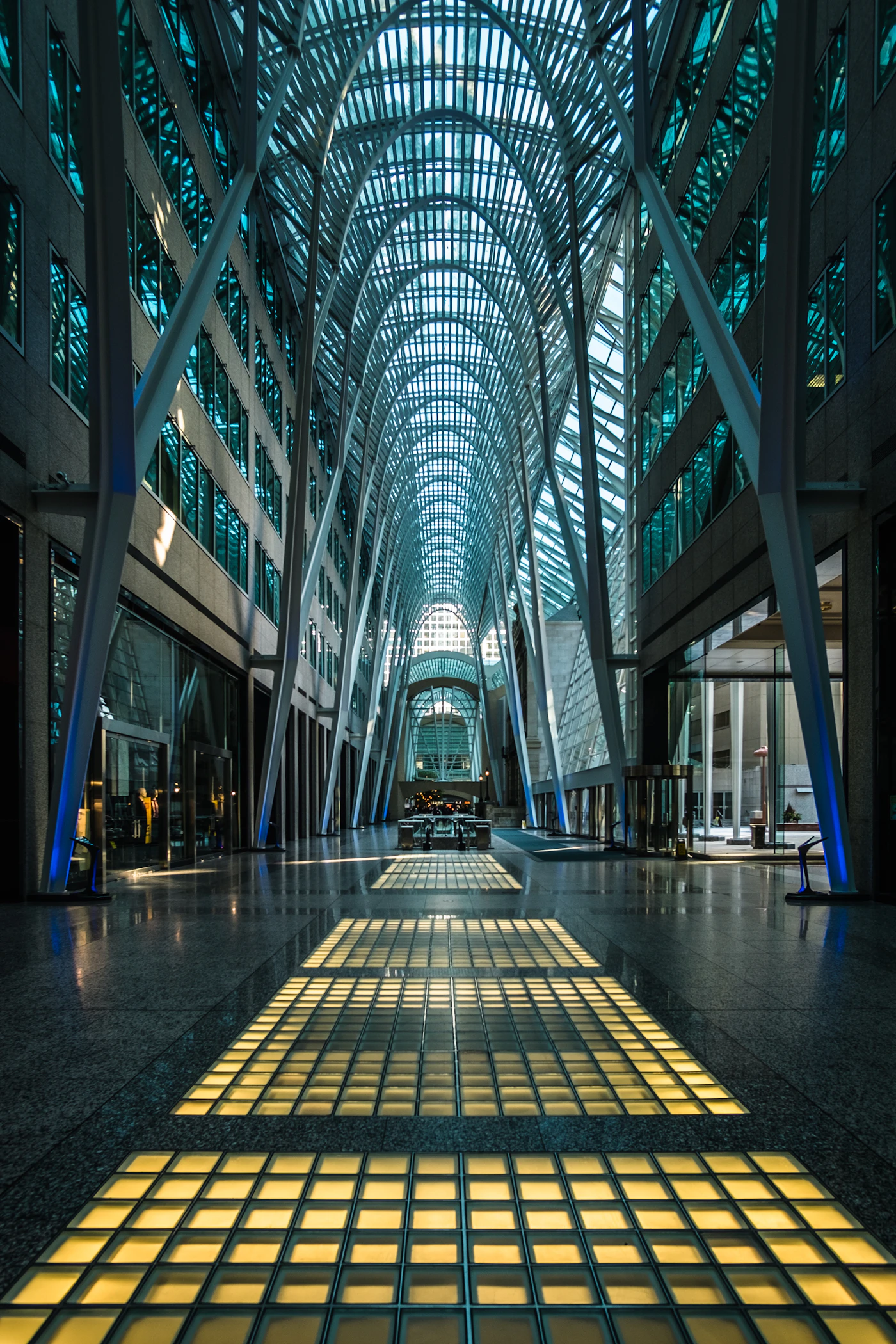 Geometric glass atrium with interconnected architectural structures