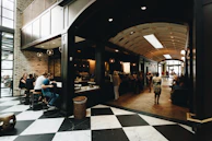 Bright and airy seating area with customers enjoying their coffee.