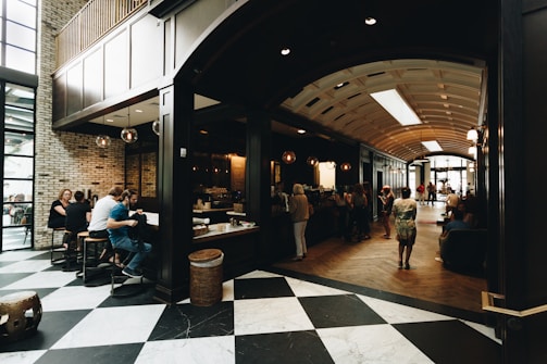 The cozy cafe area with players relaxing over coffee and snacks after a game.