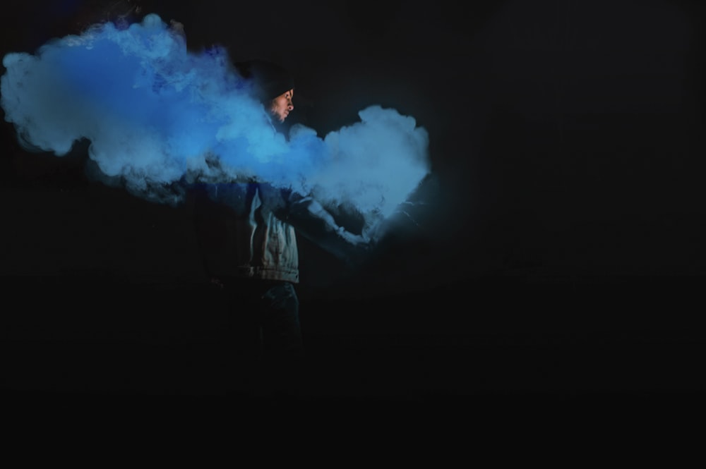 man holding smoke