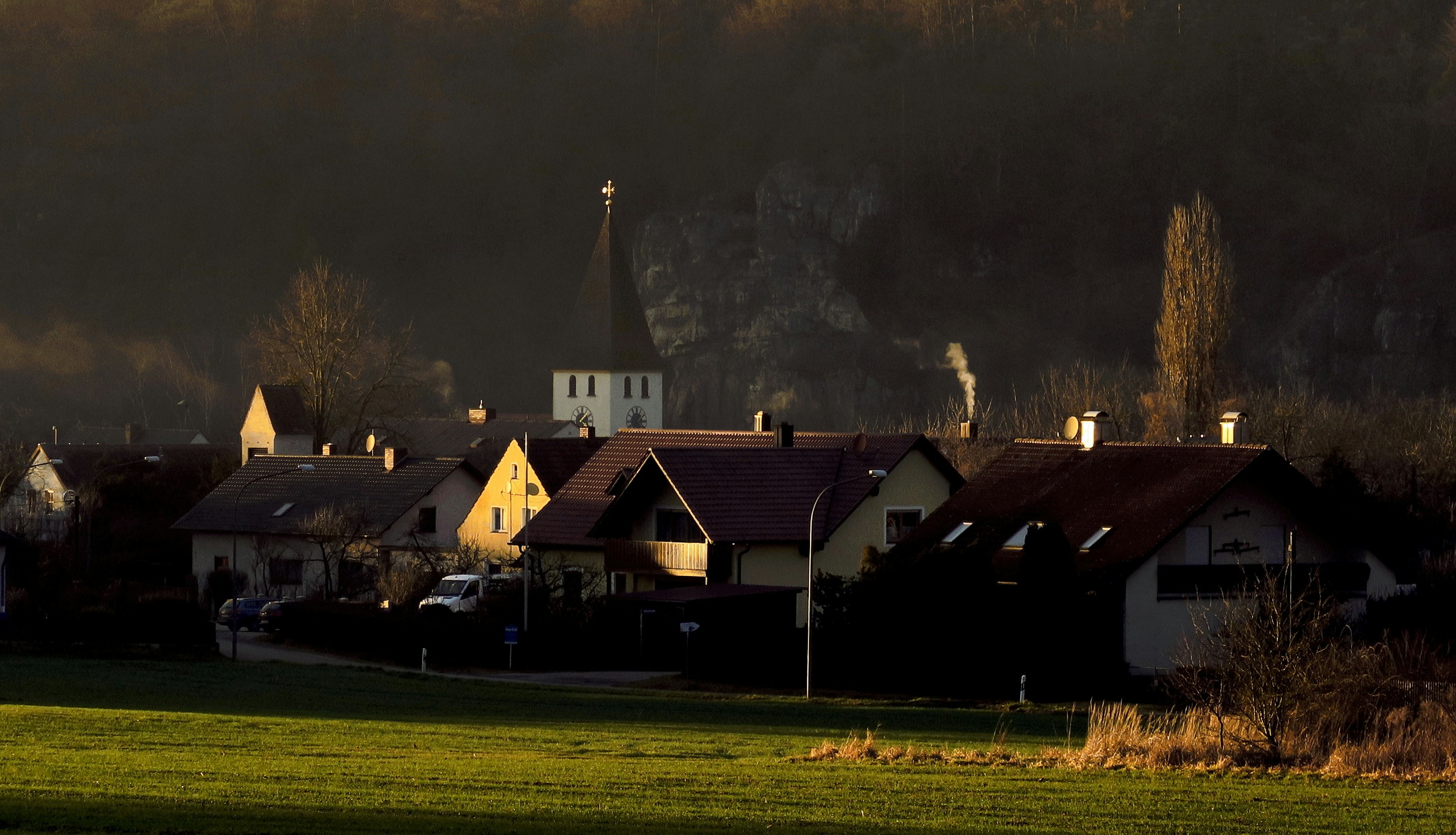 Swiss village traditional architecture, warm golden light