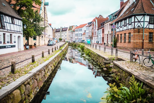 houses and body of water during daytime in Wismar Germany