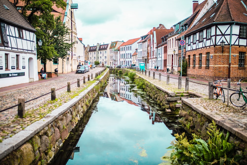 houses and body of water during daytime