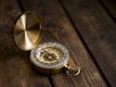 shallow focus photo of compass