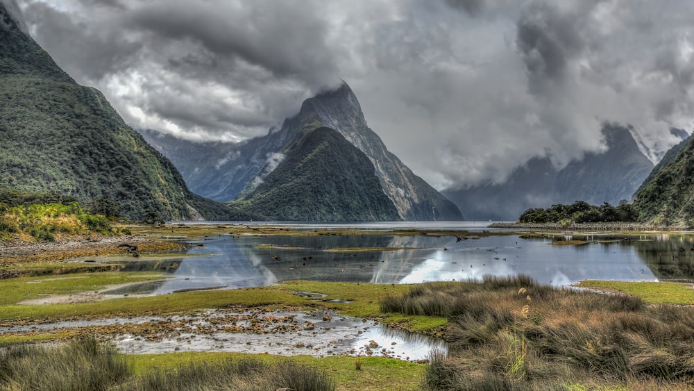 erupting mountain near lake