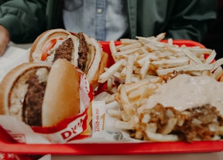 French fries and hamburgers on tray