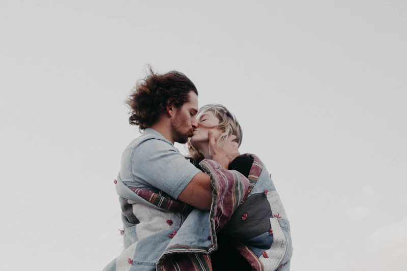 couple kissing from a low angle