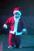 AI baby dressed as a tiny comedian on a miniature stage with a spotlight.