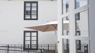 A welcoming outdoor space featuring a stylish patio umbrella.