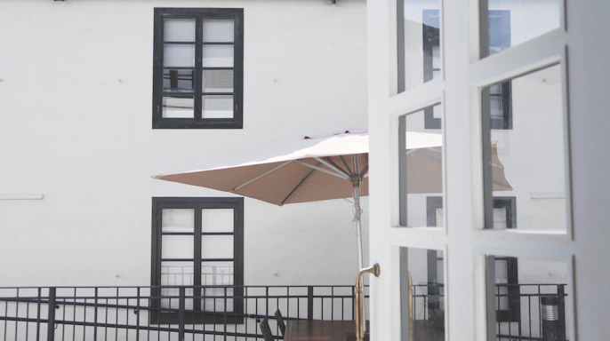 A welcoming outdoor space featuring a stylish patio umbrella.
