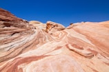 low-angle photography of brown mountains under blue sky during daytime