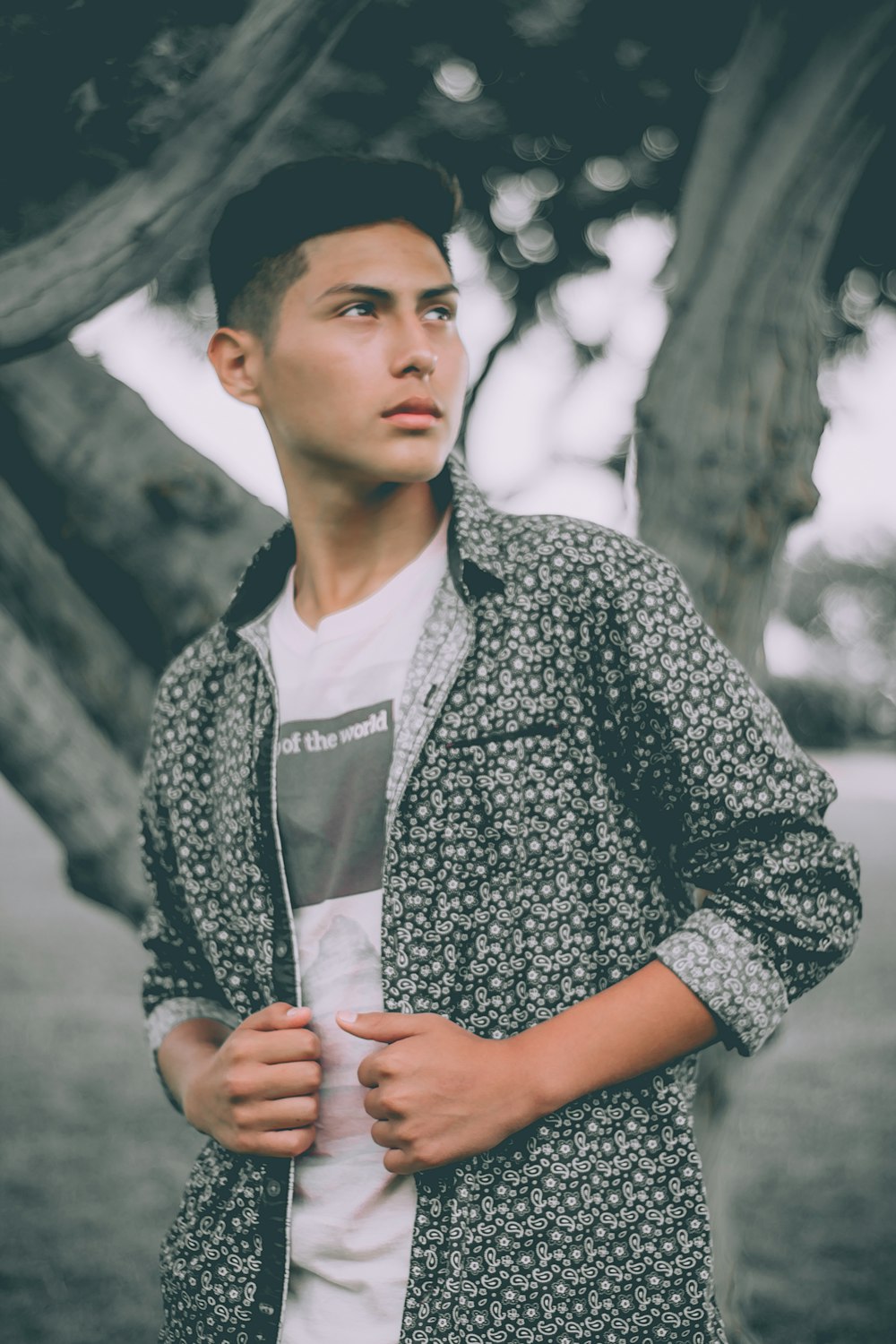 man standing near tree