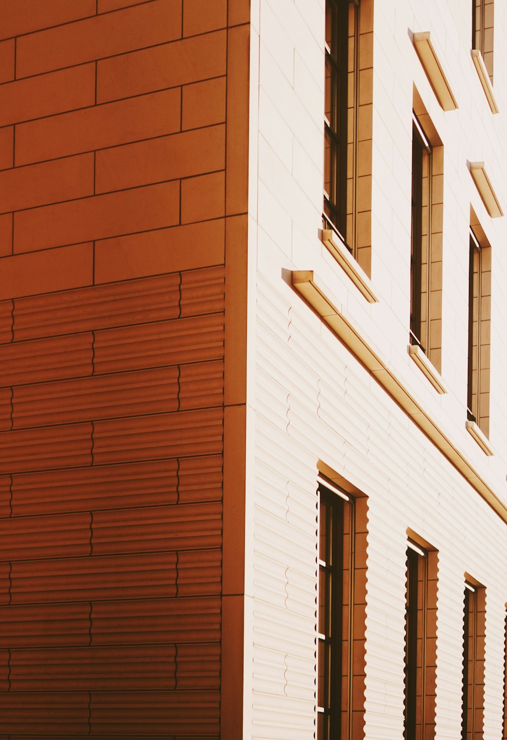 brown building with glass windows