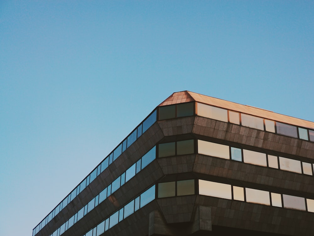 brown high rise building under blue sky