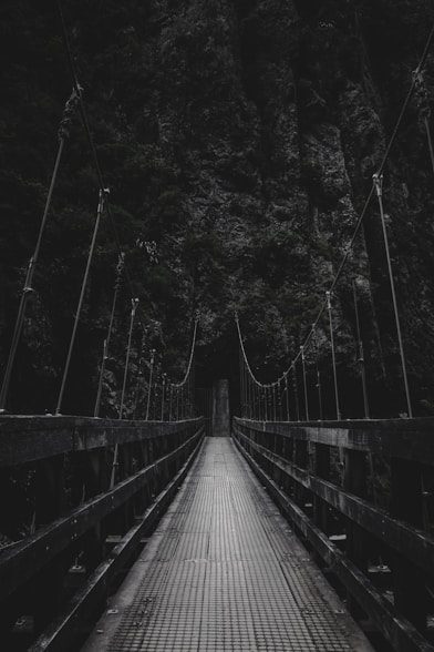 photo of bridge near mountain