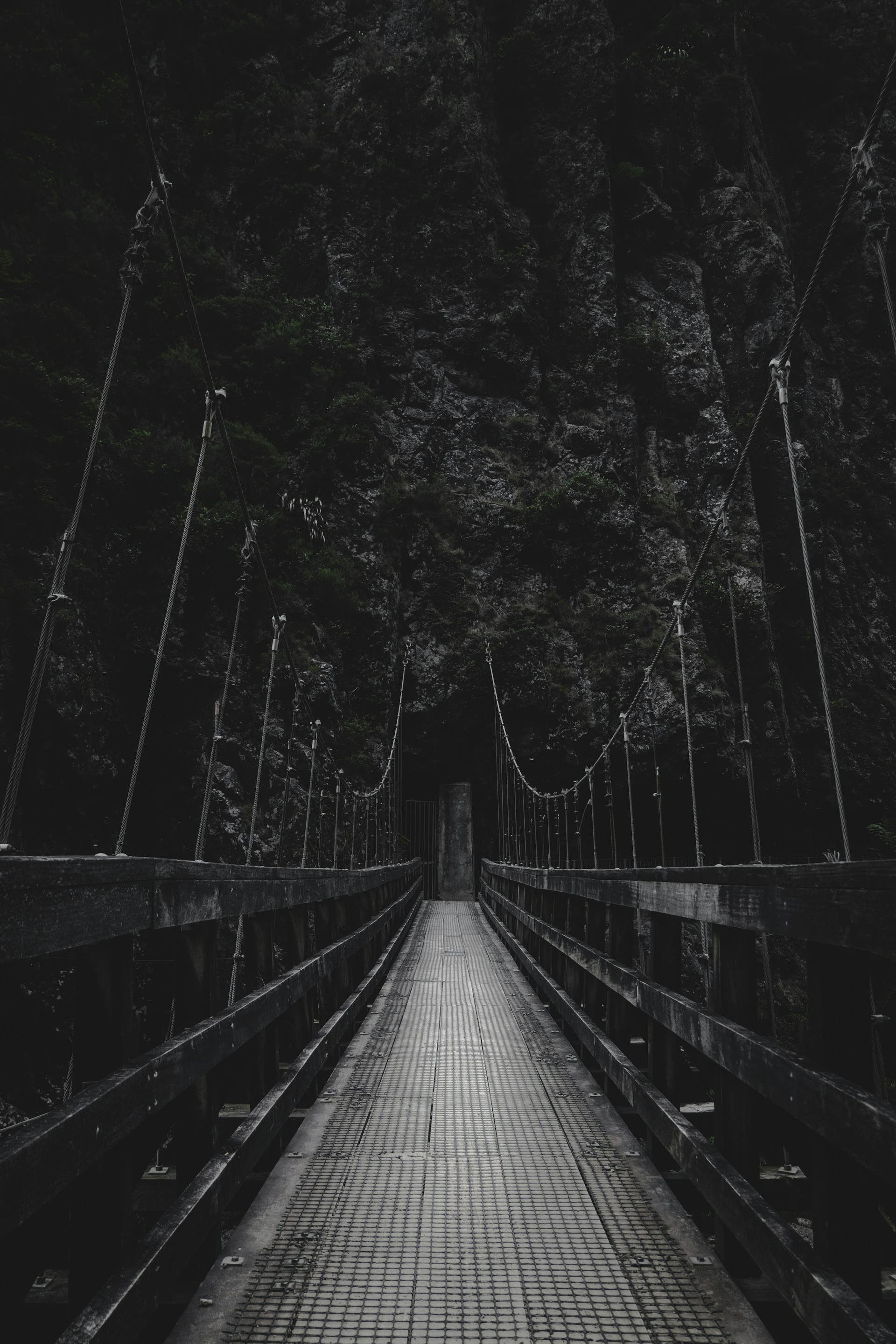 photo of bridge near mountain