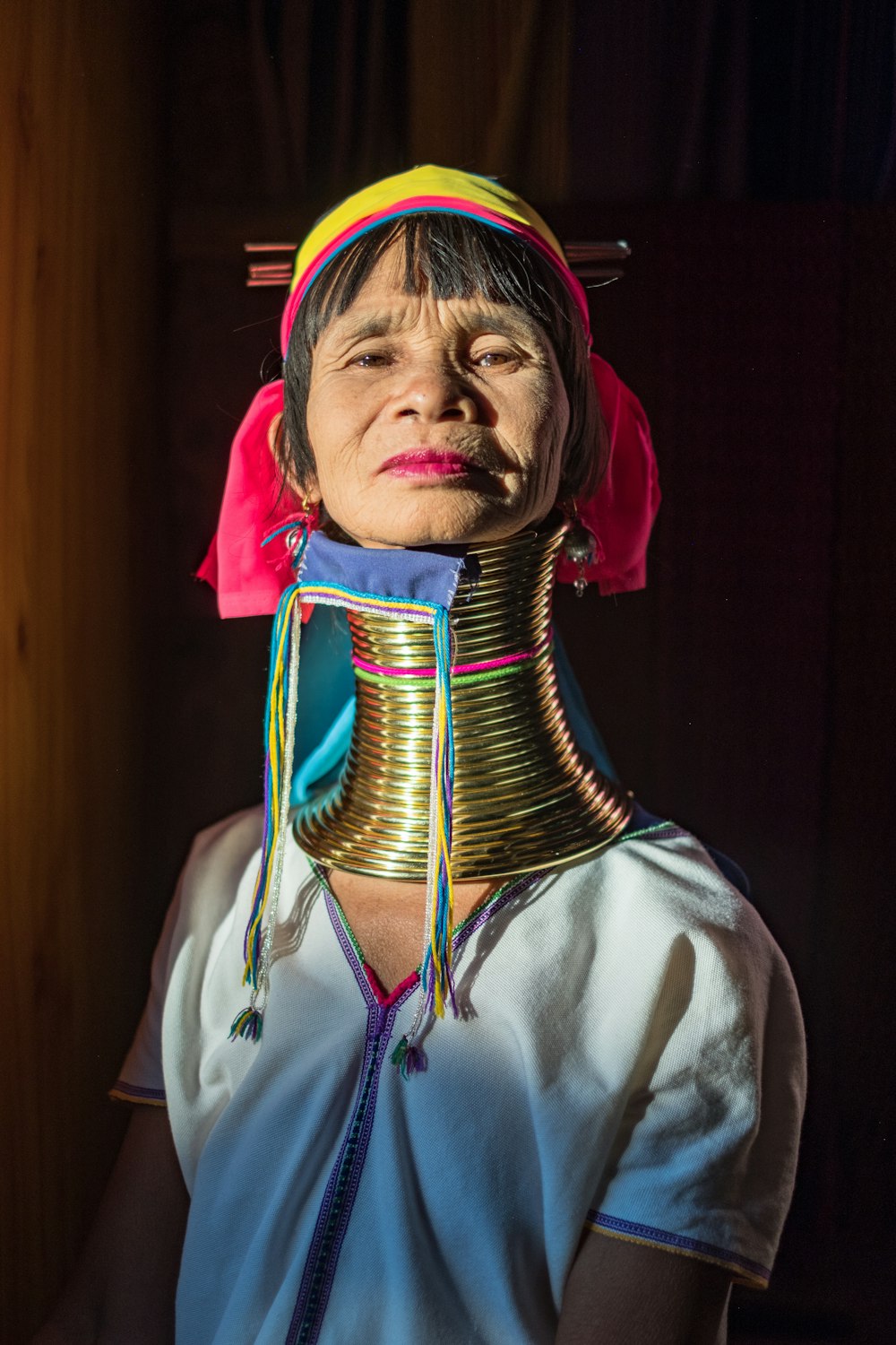 woman wearing gold-colored necklace