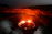 Close-up of a detailed 3D model of a volcanic crater glowing with lava.