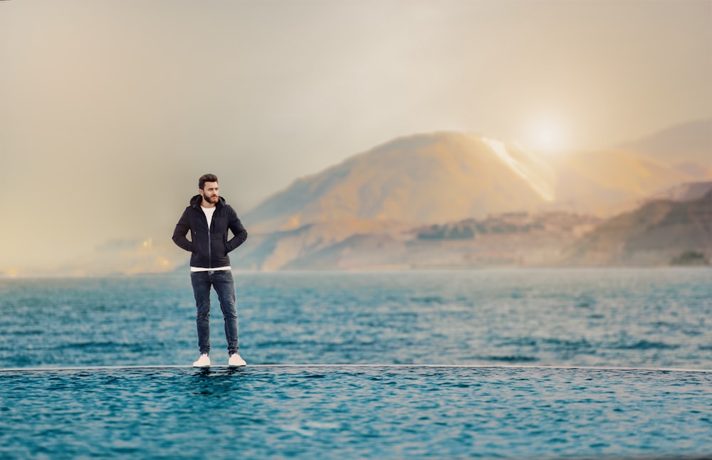man standing on body of water