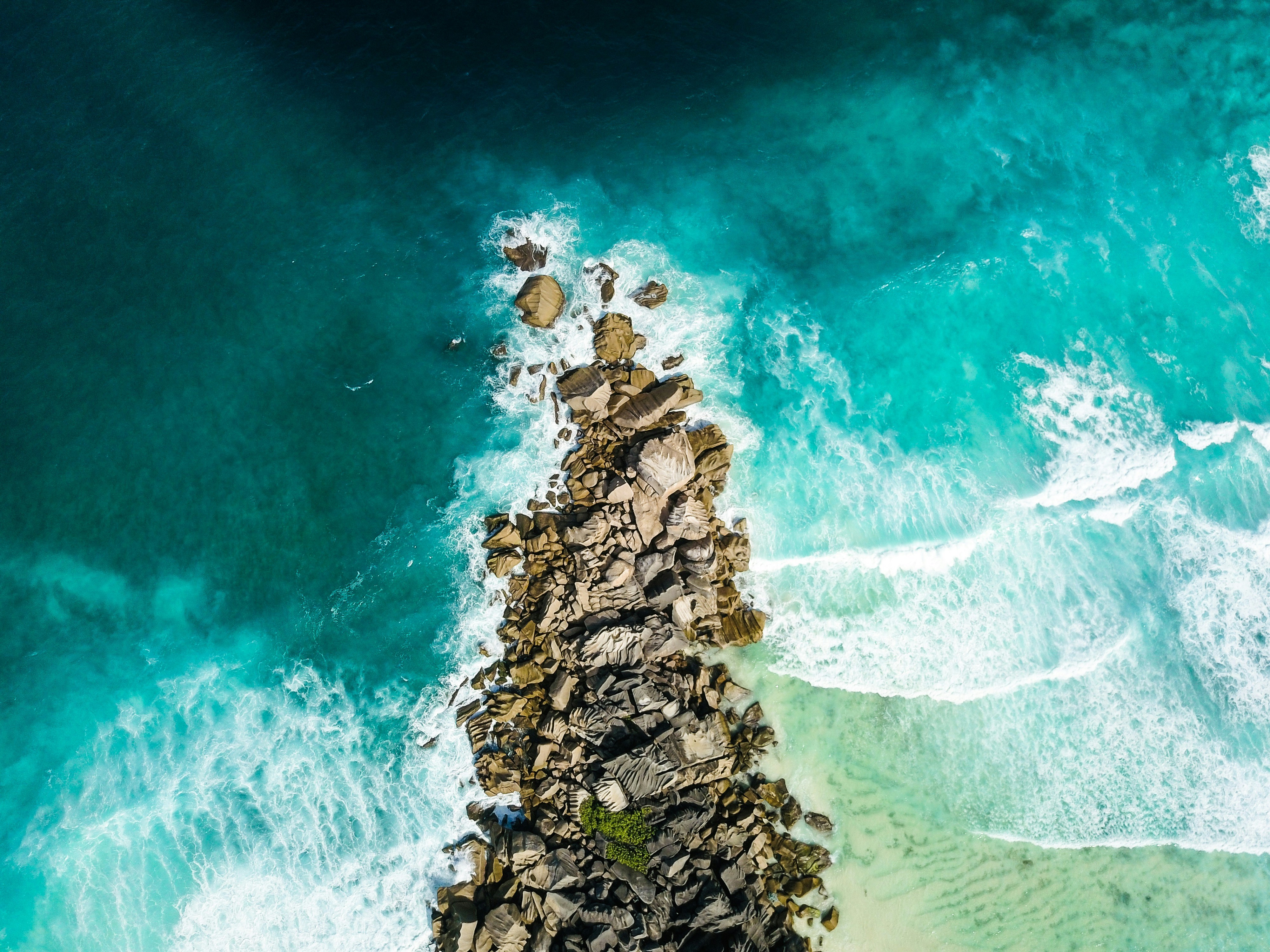 aerial view of rocks near coastline