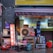 A small street-side setup includes various items such as an air conditioning unit, colorful gas canisters, a few stacked chairs, and various cooking implements like large pots and bowls. There's a neon sign displaying Chinese characters, a partial awning above, and cluttered boxes in the background.