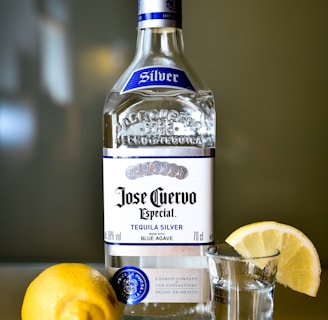 closeup photo of sealed Jose Cuervo tequila silver bottle