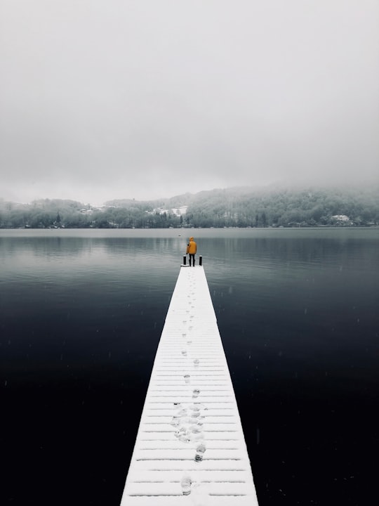 man standing on dock in Windermere United Kingdom